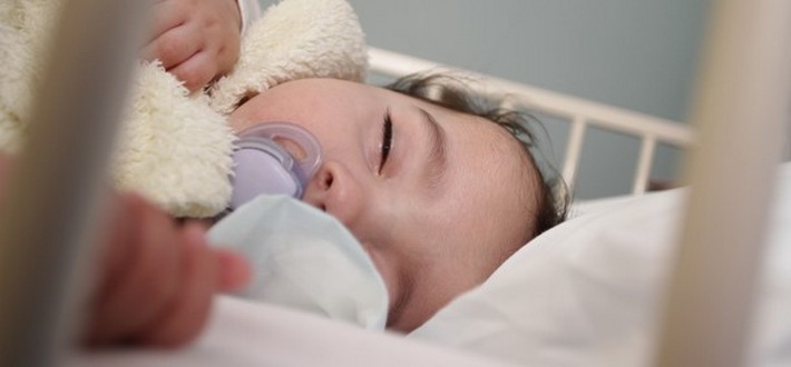baby sleeping in a hospital bed