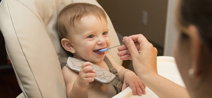 Baby being fed