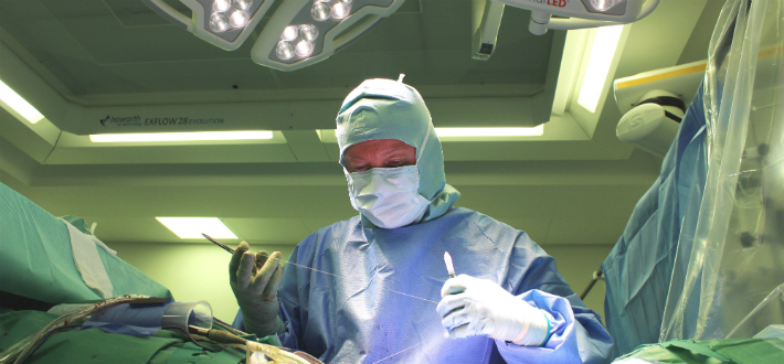 Surgeon perform operation in a theatre