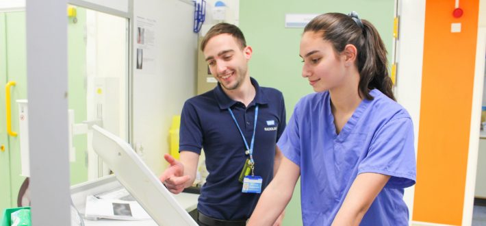 A radiology colleague works with a young female apprentice