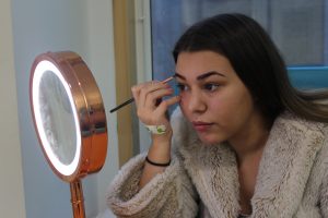 Lucy, 17 years old, putting make up on