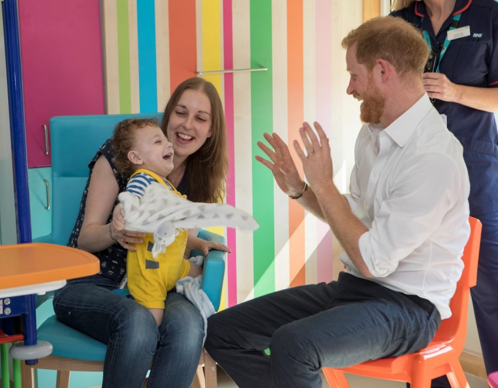 Noah and his mum Tracy playing with HRH Prince Harry