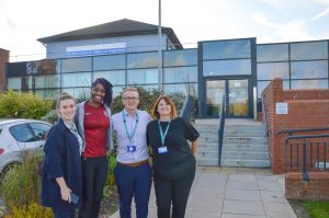 Team with Ama outside Becton