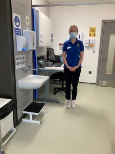 Harriet stood in clinic space at the advanced wellbeing research centre 